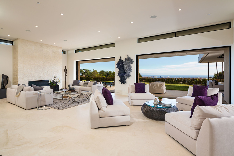 Large contemporary open concept living room in Los Angeles with white walls, a ribbon fireplace, porcelain floors, a stone fireplace surround and beige floor.