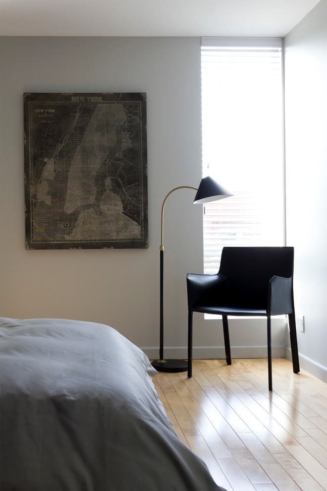 Inspiration for a small eclectic loft-style bedroom in Montreal with white walls.