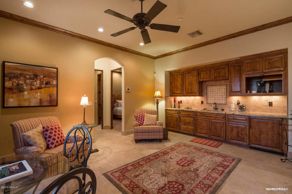 Inspiration for a mid-sized transitional single-wall travertine floor open concept kitchen remodel in Phoenix with an undermount sink, raised-panel cabinets, medium tone wood cabinets, granite countertops, beige backsplash, stone tile backsplash, paneled appliances and no island