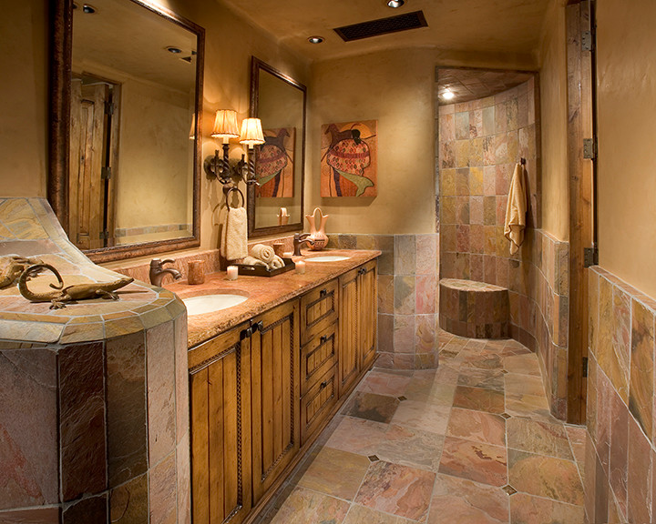 This is an example of a large master bathroom in Phoenix with beaded inset cabinets, medium wood cabinets, an alcove shower, beige tile, beige walls, an undermount sink, a drop-in tub, stone tile, granite benchtops, multi-coloured floor and a hinged shower door.
