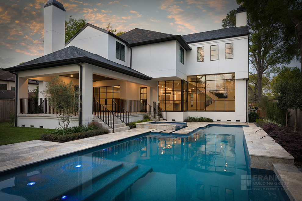 Large transitional backyard rectangular hot tub photo in Houston