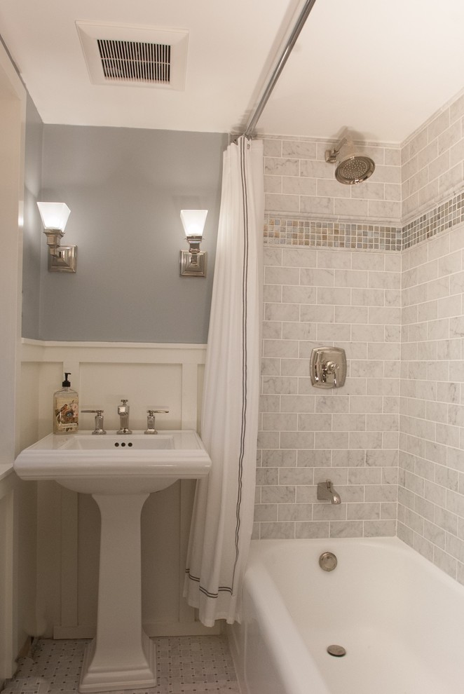 This is an example of a small country bathroom in Philadelphia with a pedestal sink, a shower/bathtub combo, a two-piece toilet, gray tile, subway tile, grey walls, marble floors, an alcove tub, grey floor and a shower curtain.