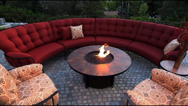 Photo of a mid-sized traditional backyard patio in Calgary with brick pavers, no cover and a fire feature.