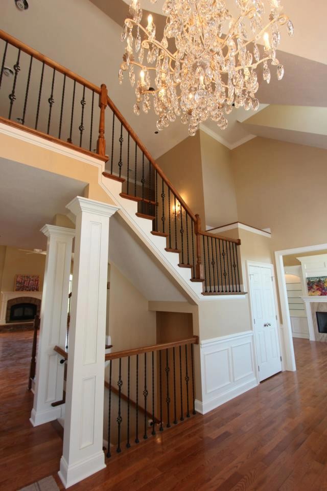 This is an example of a mid-sized traditional hallway in Other with beige walls and medium hardwood floors.