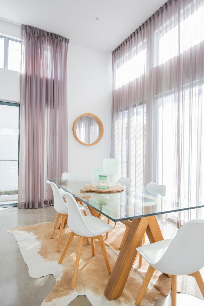 This is an example of a large contemporary kitchen/dining combo in Gold Coast - Tweed with concrete floors.