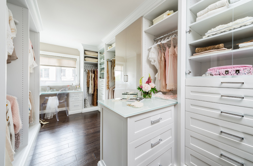 Large transitional women's dark wood floor and brown floor walk-in closet photo in Toronto with recessed-panel cabinets and white cabinets