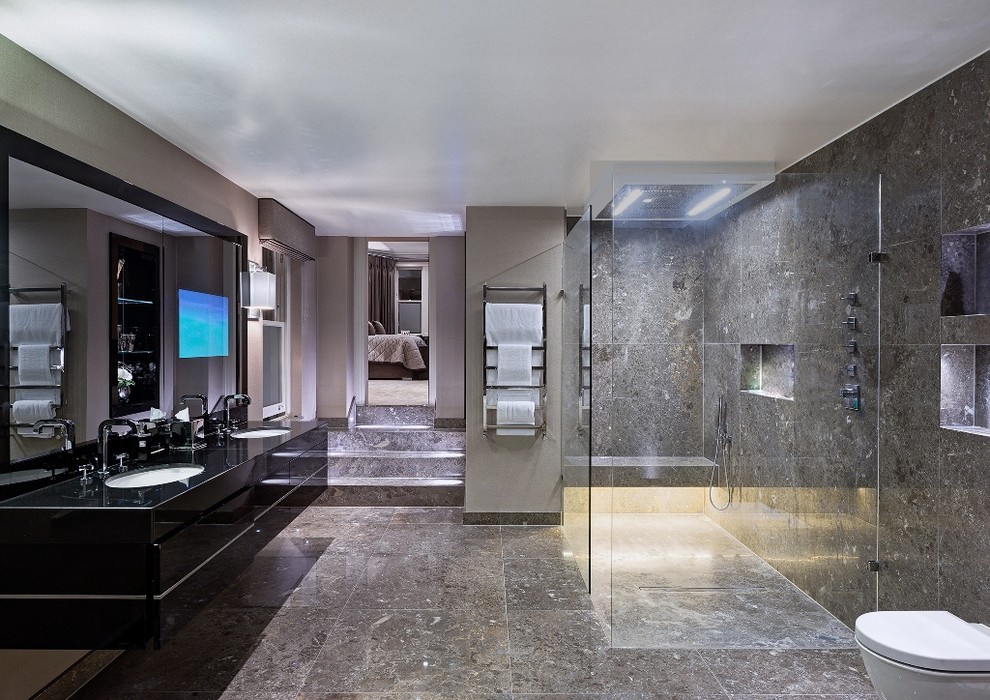 Contemporary master bathroom in London with flat-panel cabinets, black cabinets, a curbless shower, gray tile, grey walls, an undermount sink and an open shower.