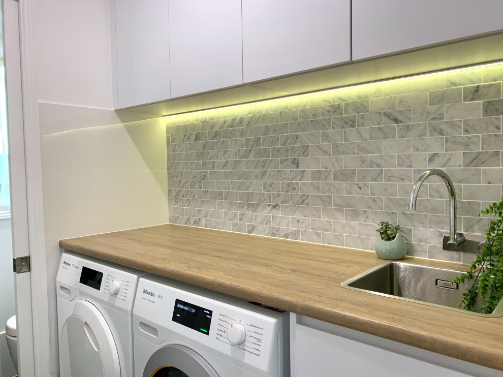 Photo of a contemporary laundry room in Sydney.