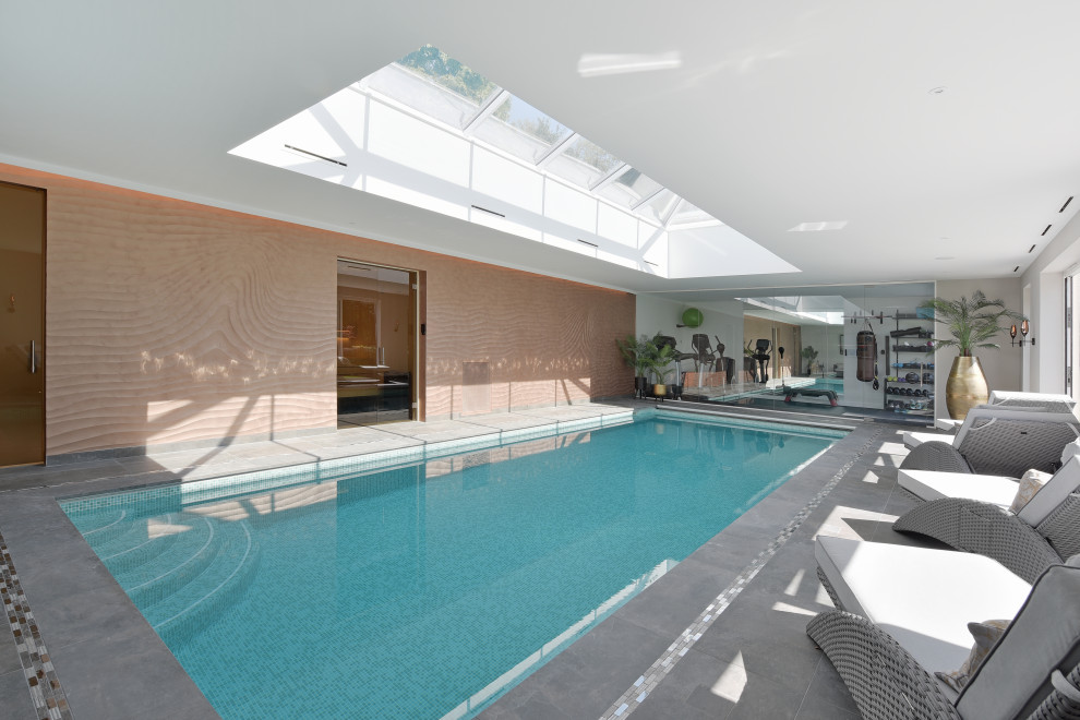 This is an example of a contemporary swimming pool in Surrey.