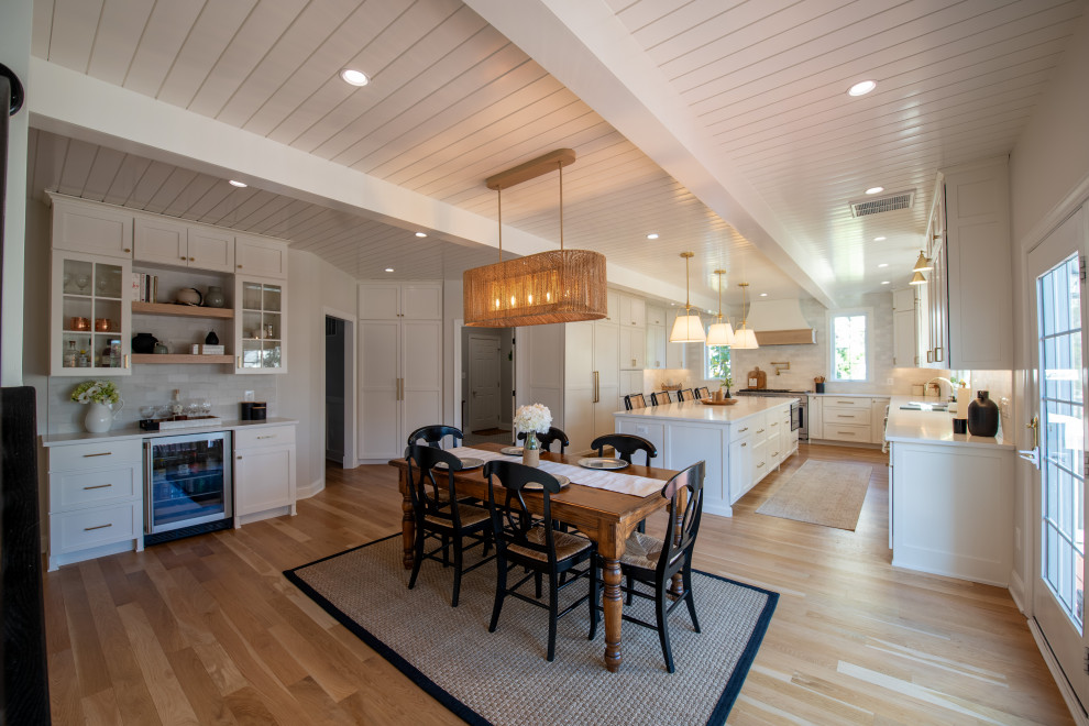 Inspiration for a large transitional kitchen/dining combo in DC Metro with light hardwood floors, white floor and timber.