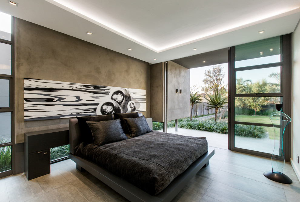 This is an example of a contemporary master bedroom in Sydney.