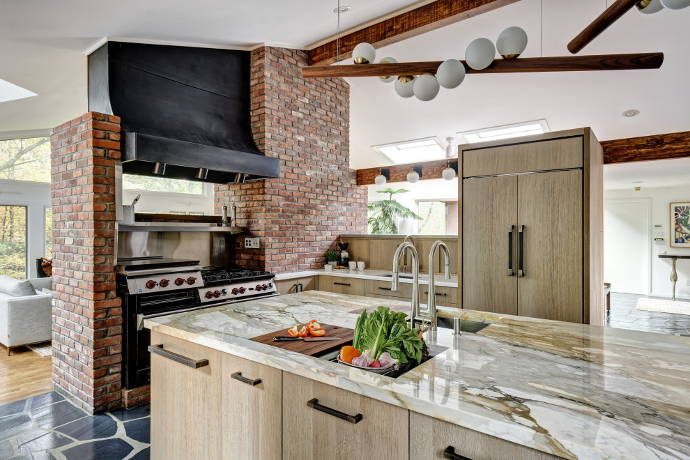 Inspiration for a large rustic l-shaped slate floor, black floor and vaulted ceiling open concept kitchen remodel in New York with an undermount sink, flat-panel cabinets, light wood cabinets, quartz countertops, paneled appliances, an island and multicolored countertops