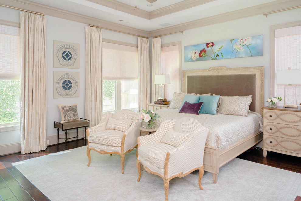 Inspiration for a transitional master bedroom in Houston with white walls, dark hardwood floors and brown floor.