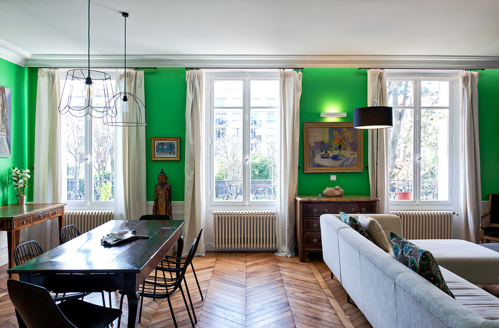 Design ideas for a large eclectic open concept family room in Paris with green walls, medium hardwood floors, a library, no fireplace and a built-in media wall.