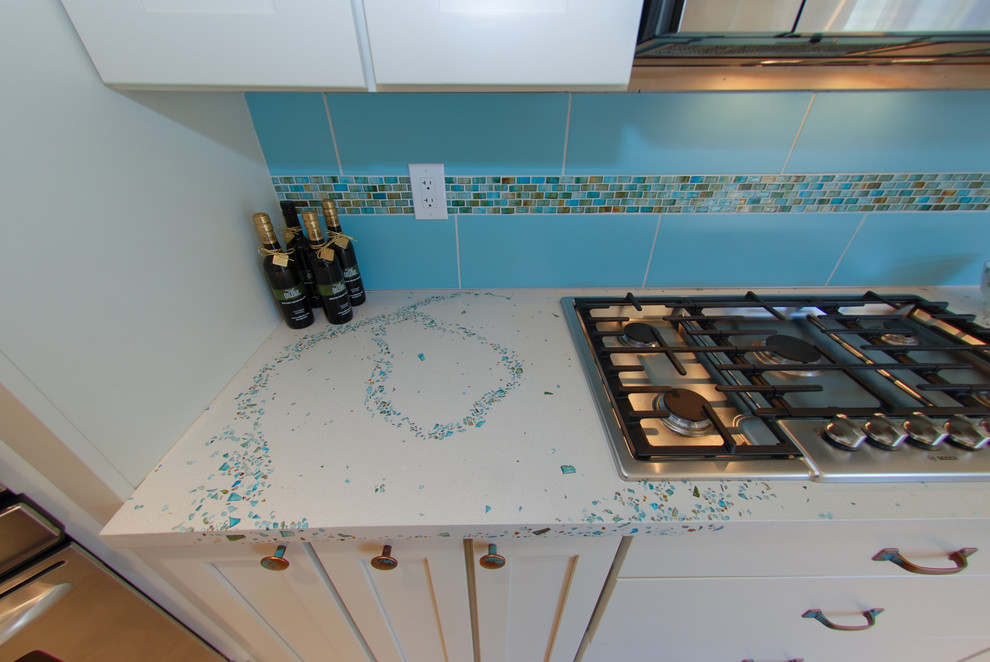 Large contemporary eat-in kitchen in Philadelphia with concrete benchtops, blue splashback and turquoise benchtop.