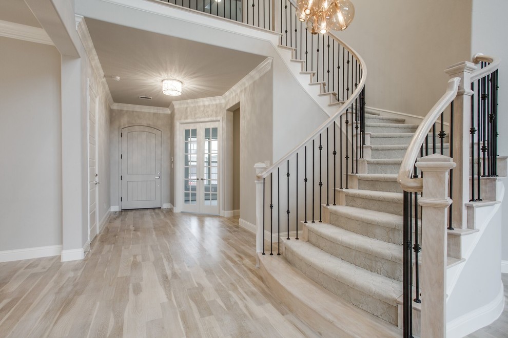 Inspiration for a large transitional curved staircase in Dallas with mixed railing.