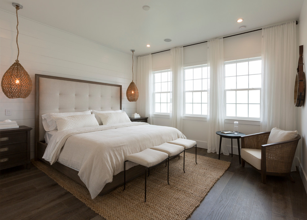 Design ideas for a mid-sized transitional master bedroom in Miami with dark hardwood floors and white walls.