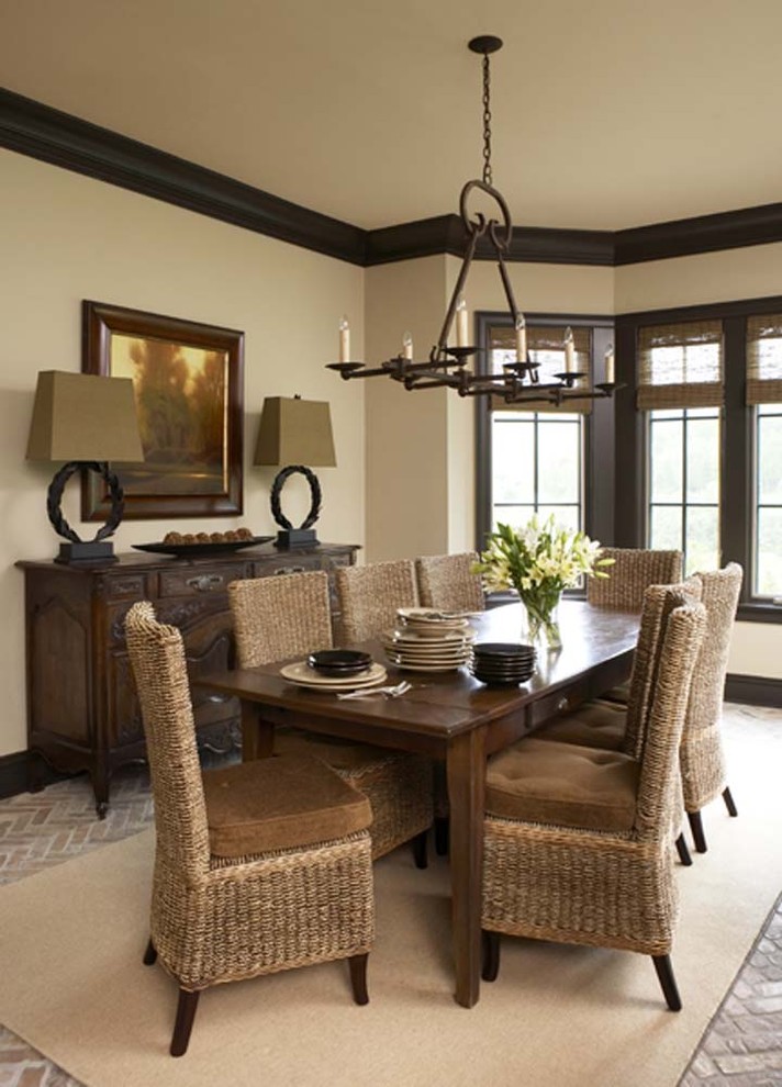 Large traditional dining room in Other with beige walls and brick floors.
