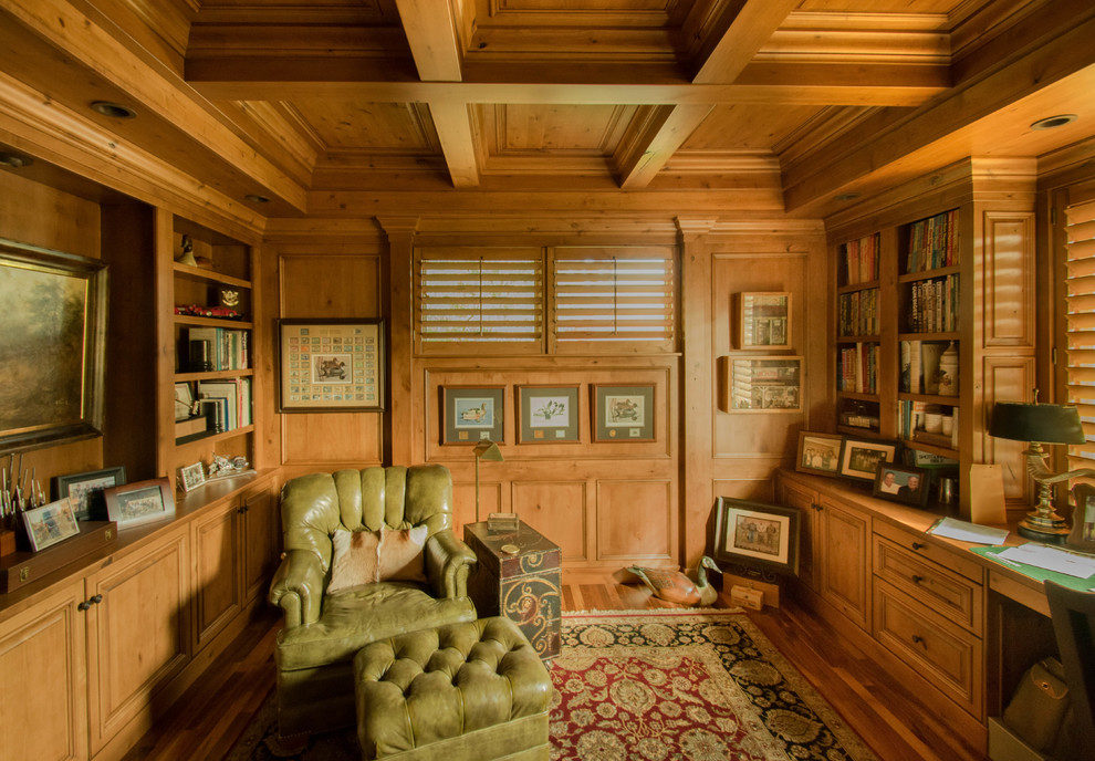 Design ideas for a traditional study room in Boise with dark hardwood floors and a built-in desk.