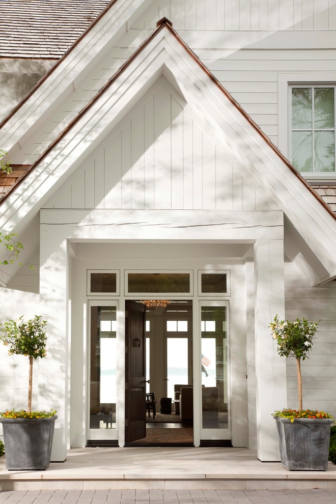Design ideas for a transitional entryway in Minneapolis with a single front door and a dark wood front door.
