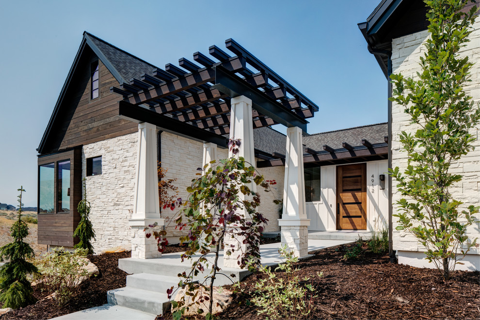 Communities - Herriman, UT (37) - Inspiration for a mid-sized country white two-story mixed siding gable roof remodel in Salt Lake City with a shingle roof