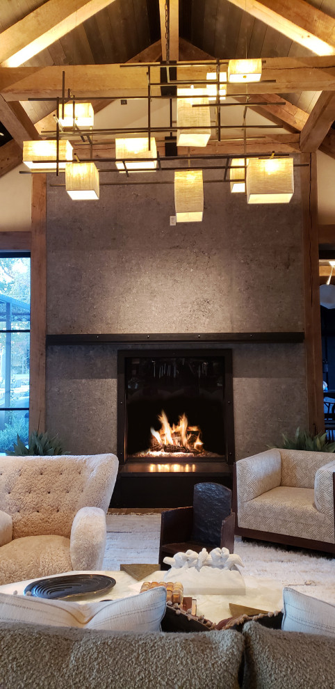 サンフランシスコにあるお手頃価格の広いトラディショナルスタイルのおしゃれな独立型リビング (グレーの壁、標準型暖炉、コンクリートの暖炉まわり、テレビなし、白い床、表し梁) の写真