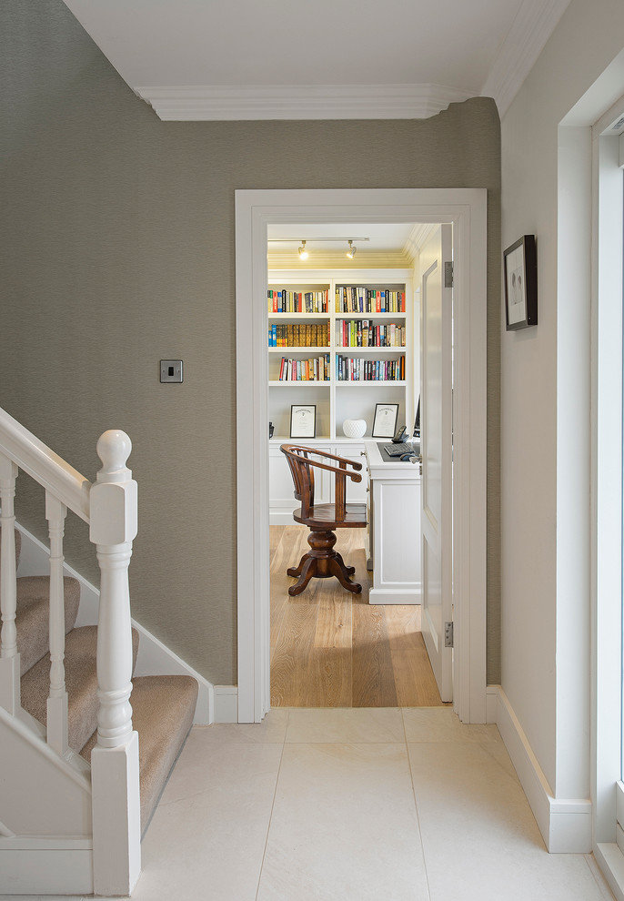 Design ideas for a transitional hallway in Dublin with beige walls and ceramic floors.