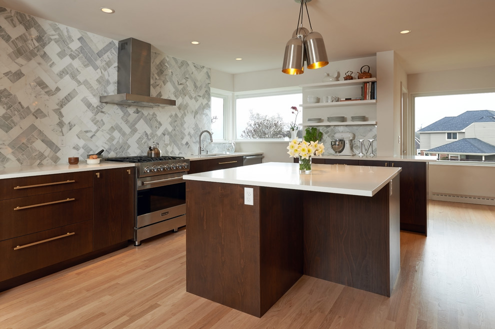 Inspiration for a large midcentury l-shaped eat-in kitchen in Seattle with a single-bowl sink, flat-panel cabinets, dark wood cabinets, quartz benchtops, multi-coloured splashback, stone tile splashback, stainless steel appliances, light hardwood floors and with island.
