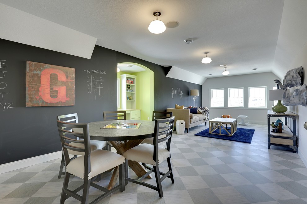 This is an example of a large transitional gender-neutral kids' playroom for kids 4-10 years old in Minneapolis with multi-coloured walls and linoleum floors.