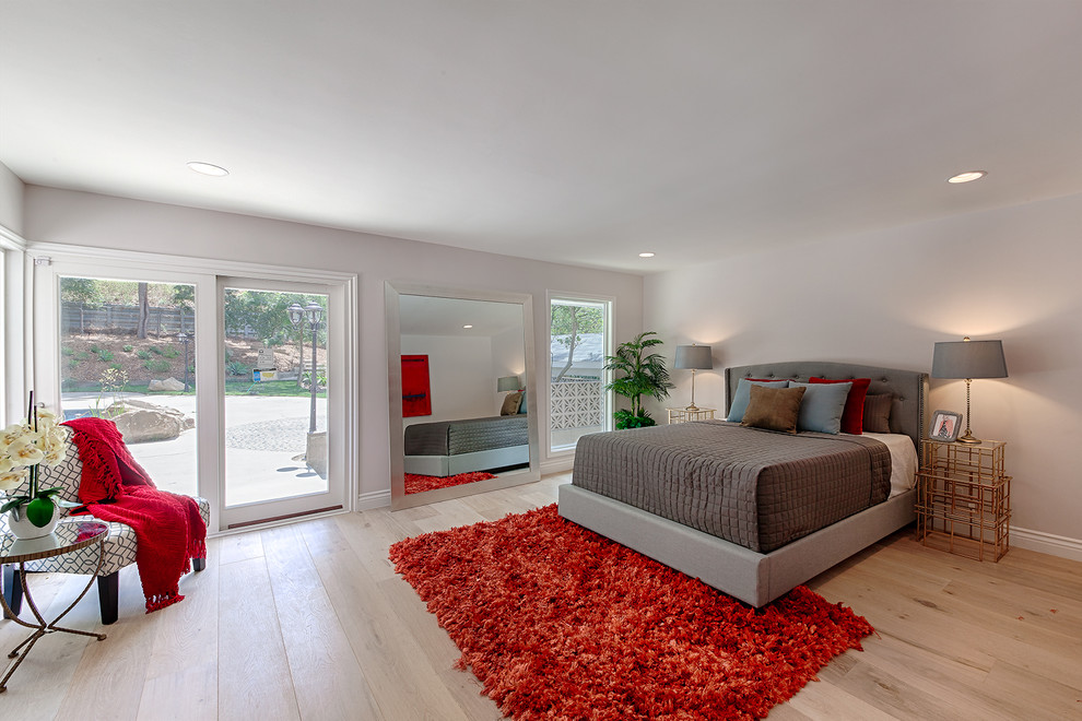 Traditional bedroom in Los Angeles with medium hardwood flooring.
