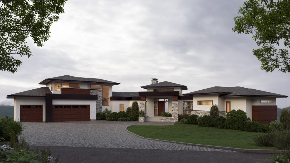 Design ideas for a large modern one-storey stucco white house exterior in Calgary with a shingle roof.