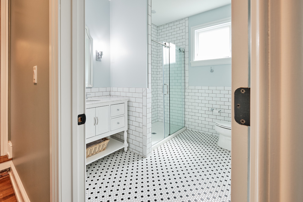 This is an example of a small eclectic 3/4 bathroom in Philadelphia with furniture-like cabinets, white cabinets, an alcove shower, a two-piece toilet, white tile, subway tile, grey walls, mosaic tile floors, an undermount sink, onyx benchtops, white floor, a hinged shower door and multi-coloured benchtops.