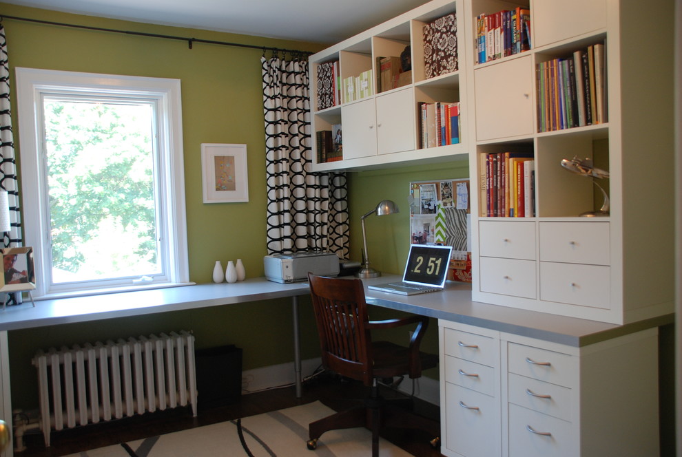 Inspiration for a transitional home office in Toronto with green walls.