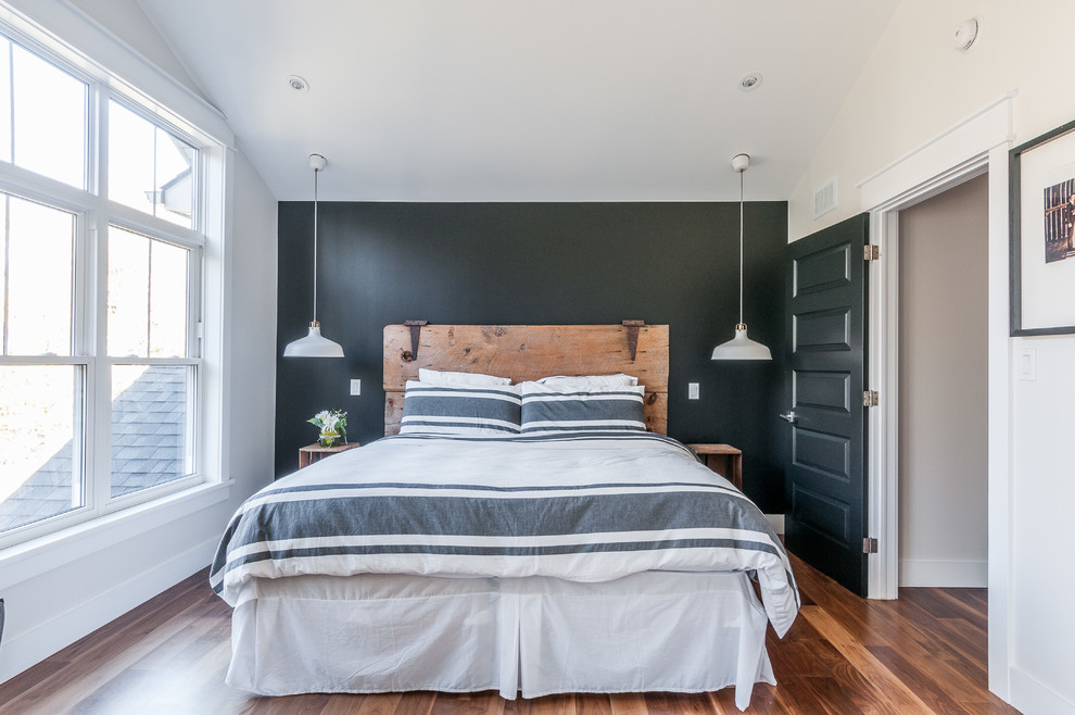 Example of a transitional guest medium tone wood floor bedroom design in Toronto with blue walls and no fireplace
