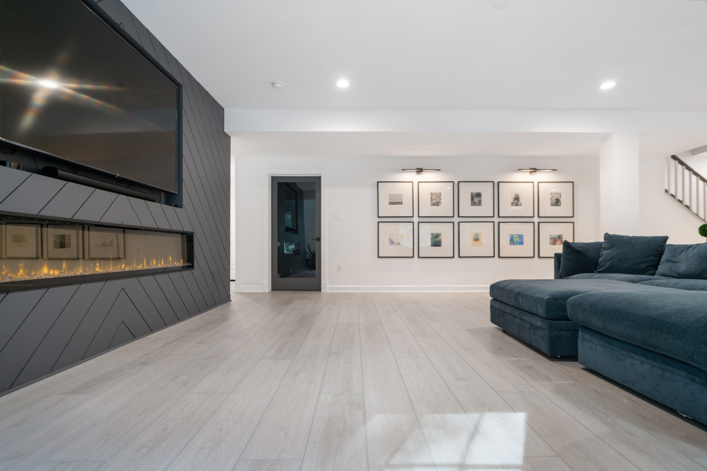 Photo of a medium sized modern open plan living room in Richmond with white walls, vinyl flooring, all types of fireplace, a timber clad chimney breast, a built-in media unit, grey floors, all types of ceiling and all types of wall treatment.