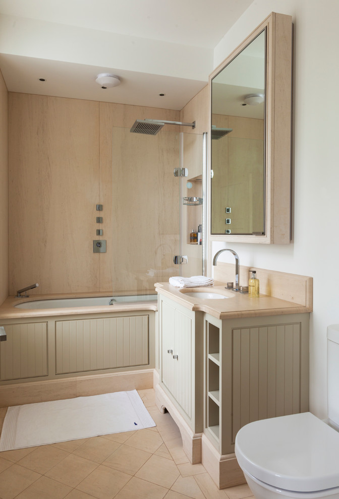 Inspiration for a traditional bathroom in London with an alcove tub and a shower/bathtub combo.