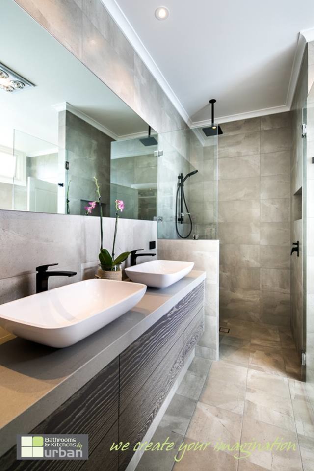 This is an example of a large modern 3/4 bathroom in Adelaide with furniture-like cabinets, grey cabinets, a freestanding tub, an alcove shower, gray tile, cement tile, grey walls and ceramic floors.