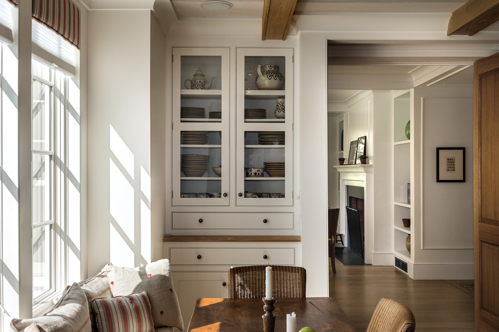 Design ideas for a country eat-in kitchen in New York with shaker cabinets, white cabinets and panelled appliances.