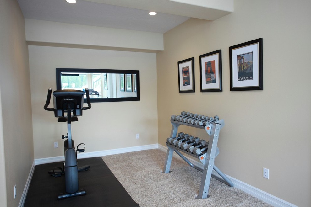 This is an example of a mid-sized traditional multipurpose gym in Seattle with beige walls, carpet and beige floor.