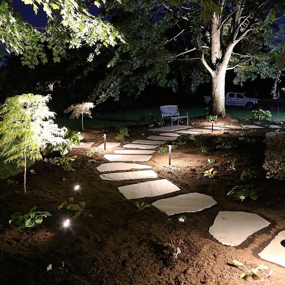 Inspiration for a mid-sized asian backyard partial sun garden for summer in Other with a garden path and natural stone pavers.