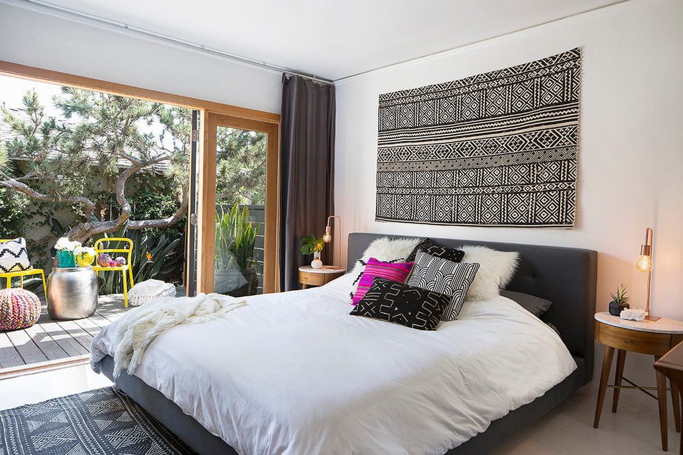 Inspiration for a large transitional master bedroom in Los Angeles with white walls and no fireplace.