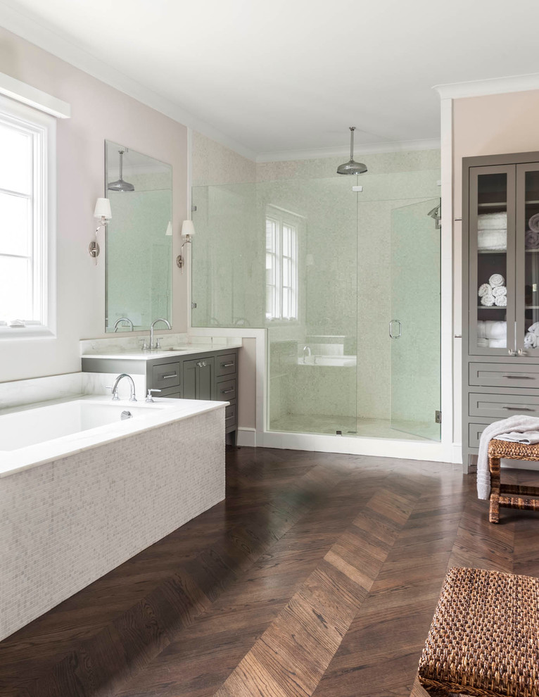 Design ideas for a transitional master bathroom in Dallas with an undermount sink, furniture-like cabinets, grey cabinets, marble benchtops, a corner shower, white tile, beige walls and dark hardwood floors.
