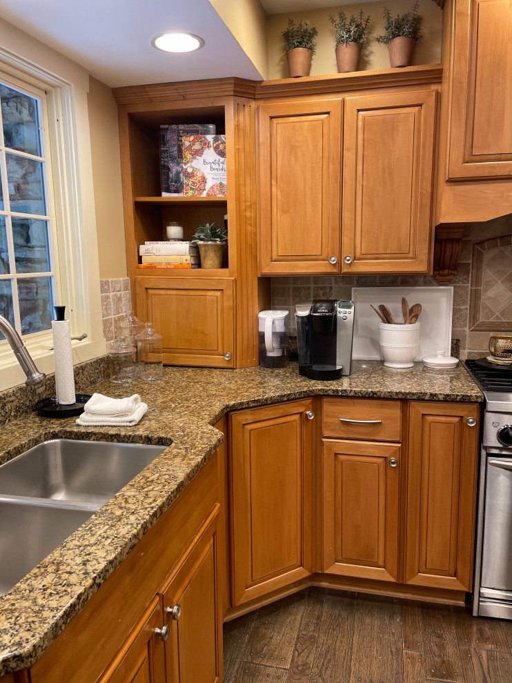 Kitchen - transitional medium tone wood floor kitchen idea in Indianapolis with an undermount sink, medium tone wood cabinets, quartzite countertops, white backsplash, ceramic backsplash, an island and beige countertops