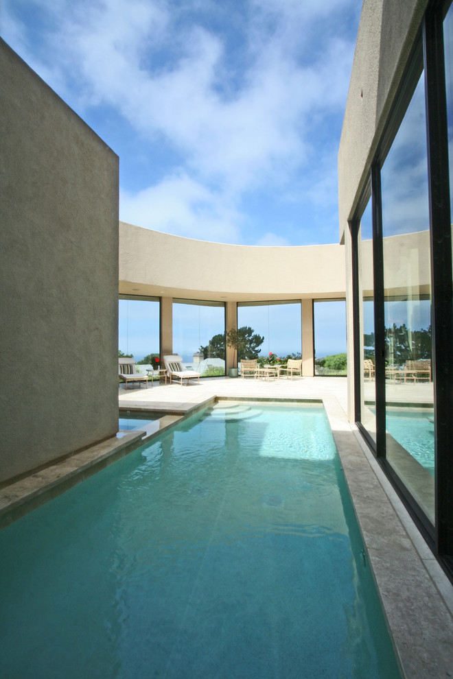 Contemporary courtyard rectangular lap pool in San Diego with concrete slab.