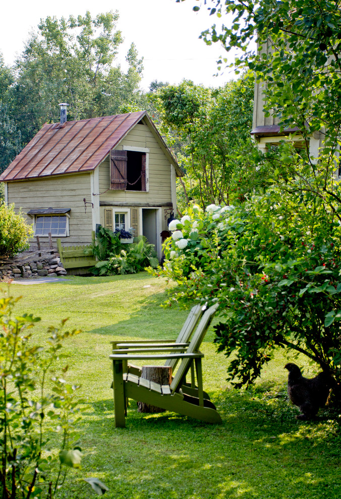 Example of a country exterior home design in New York