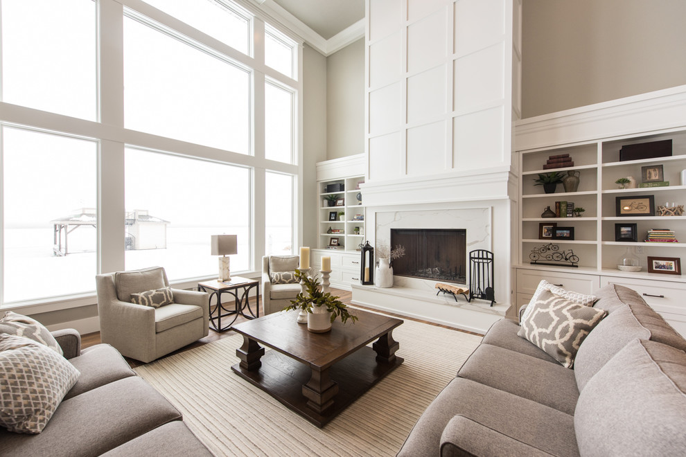 Photo of a large transitional formal open concept living room in Salt Lake City with beige walls, medium hardwood floors, a standard fireplace, a stone fireplace surround and brown floor.
