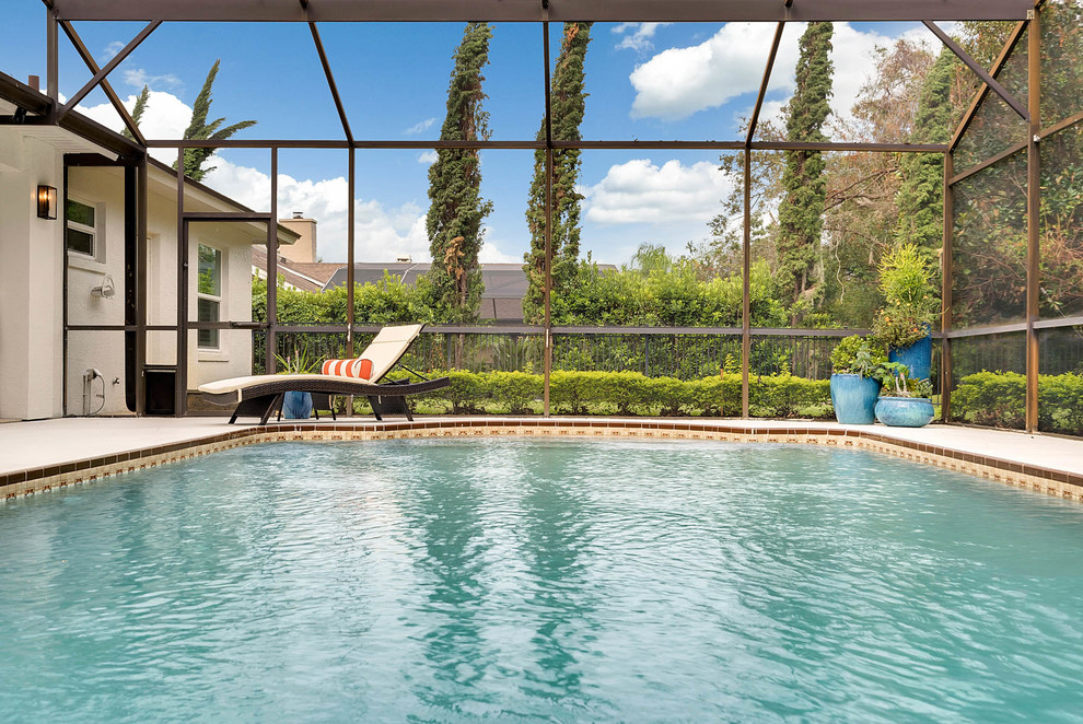 Inspiration for a large transitional indoor concrete and custom-shaped lap pool remodel in Orlando