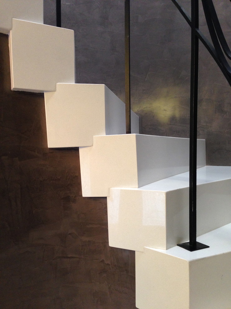 Photo of a mid-sized contemporary tile u-shaped staircase in Miami with tile risers.