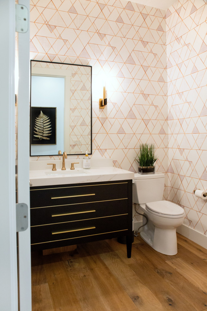 Mid-sized midcentury master bathroom in Other with furniture-like cabinets, medium wood cabinets, a two-piece toilet, white walls, light hardwood floors, an undermount sink, quartzite benchtops, white benchtops, a single vanity, a freestanding vanity and wallpaper.