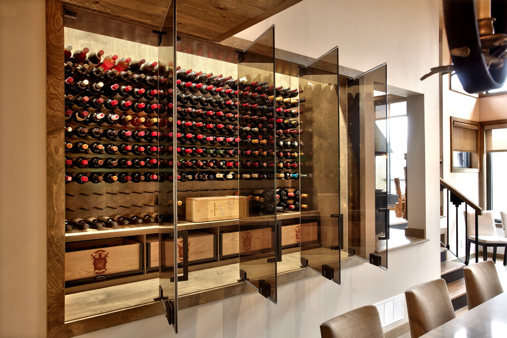 Inspiration for a mid-sized modern wine cellar in Montreal with display racks.